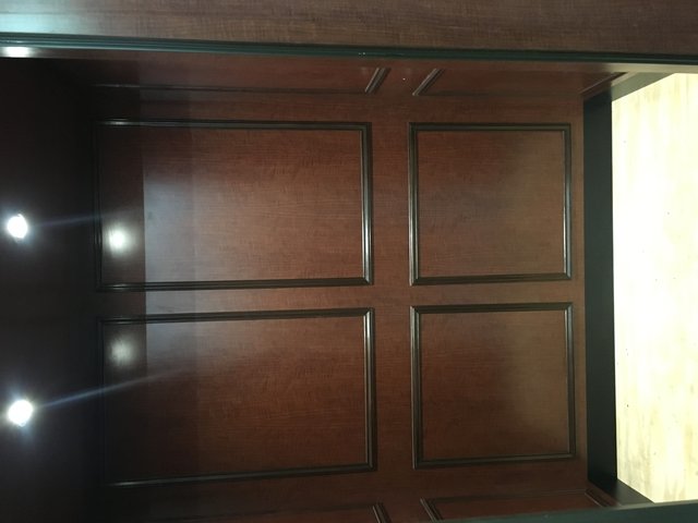 Dark brown wood elevator cab