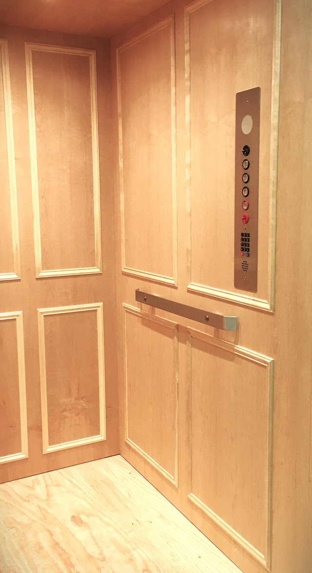 Light wood cab with stainless steel fixtures